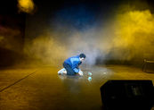 Guy center stage lit.